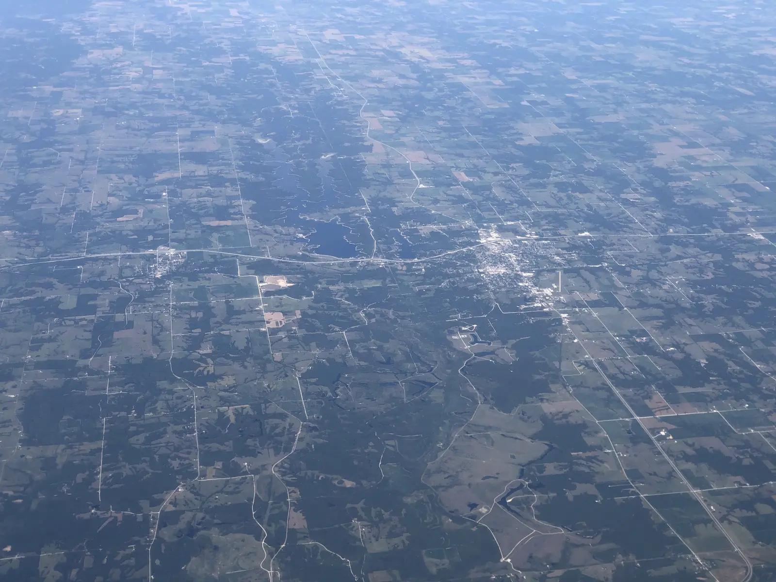 Aerial view of farm ground and timber around Macon, Missouri