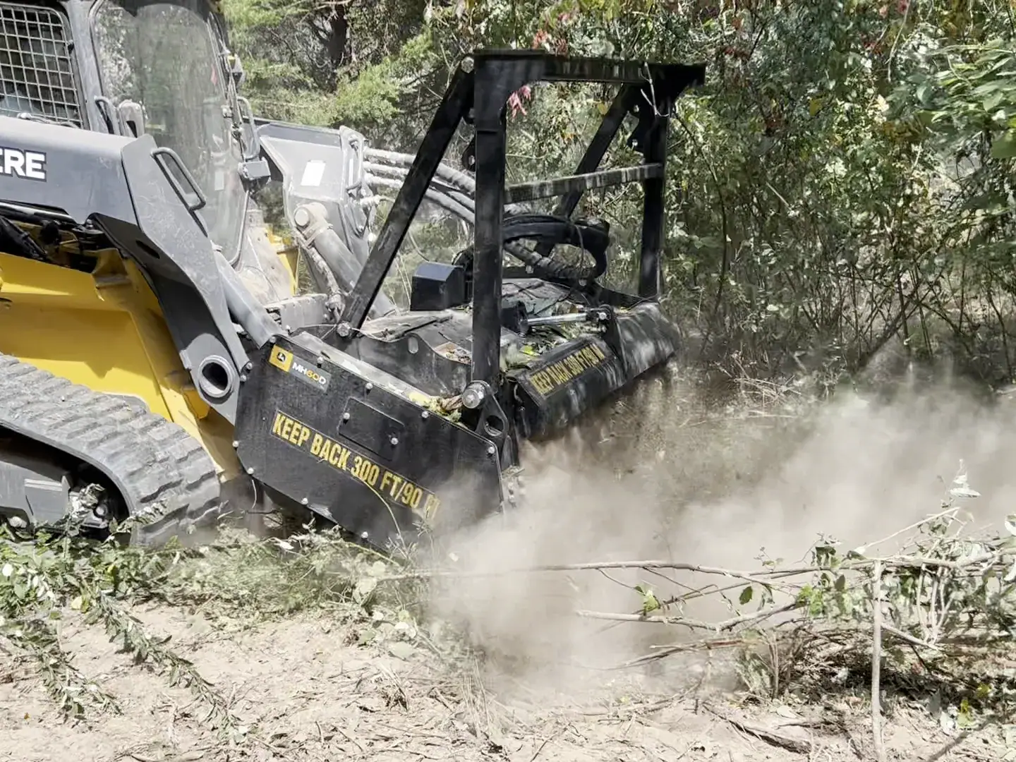 Forestry mulcher with the head down grinding brush and saplings