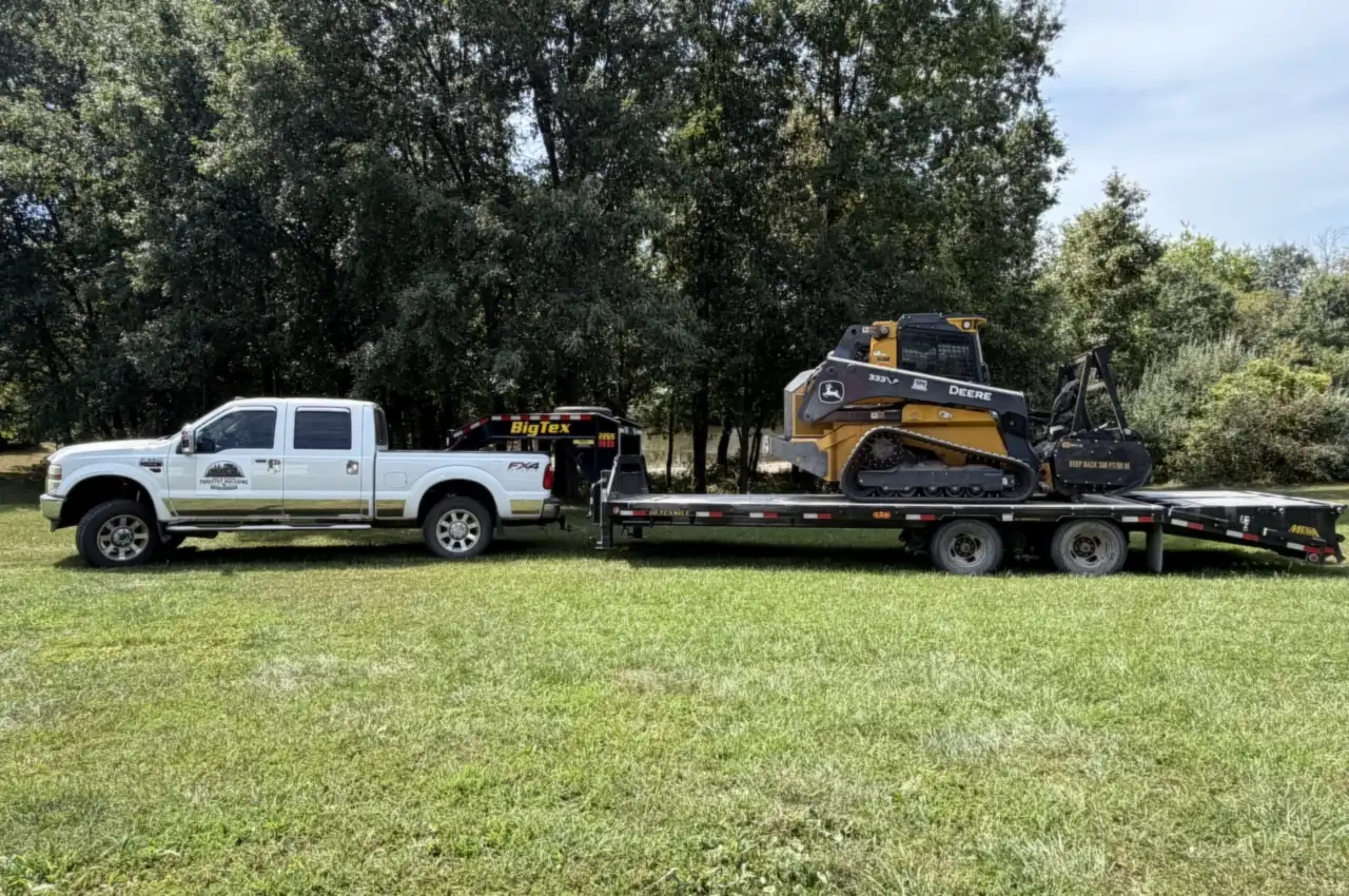Mid Missouri Forestry Mulching truck and gooseneck trailer with the forestry mulcher loaded